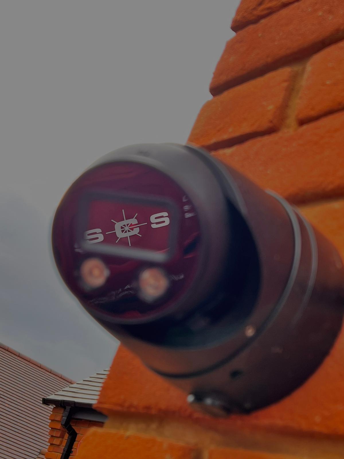 a man sitting in front of multiple monitors