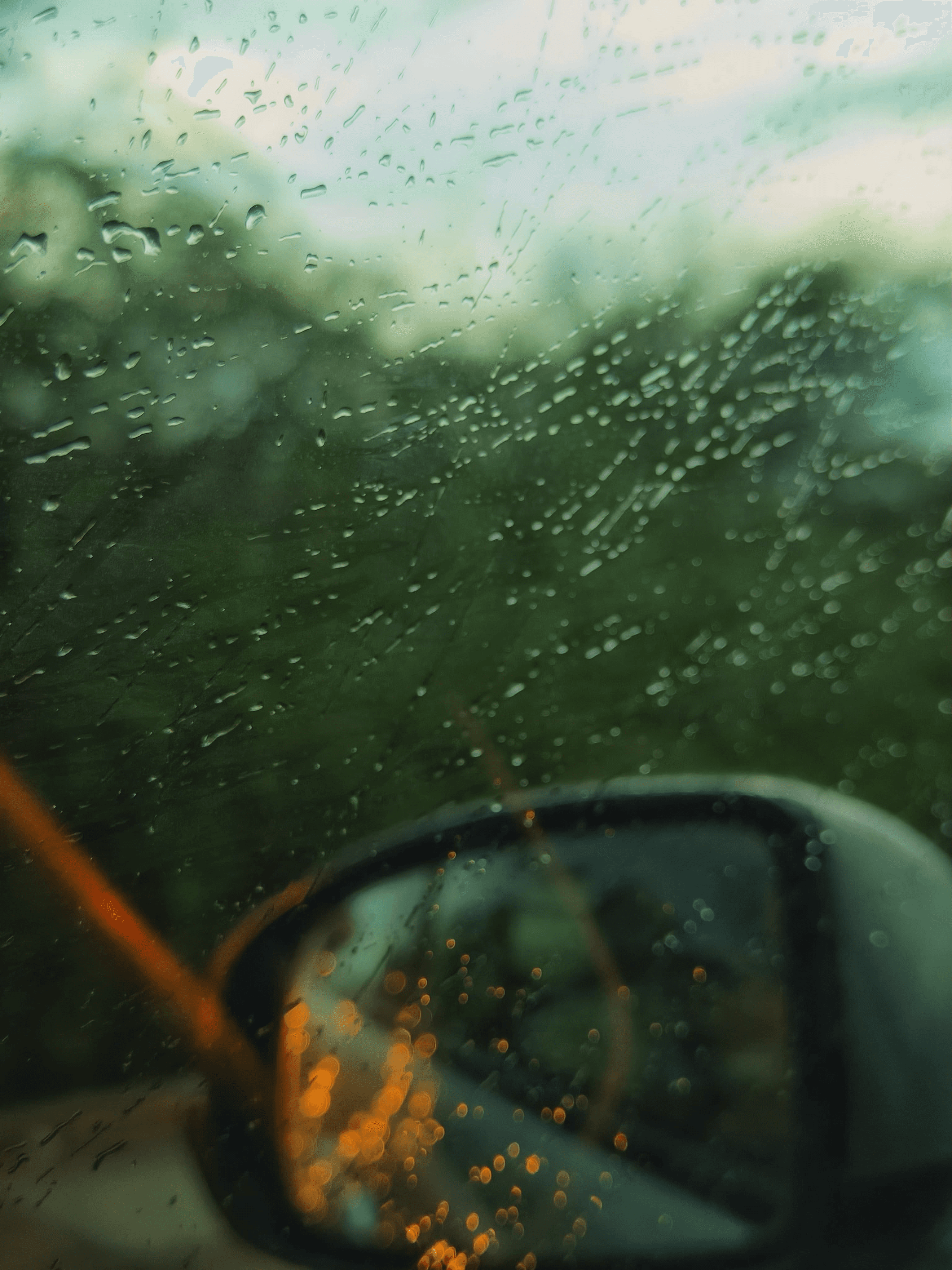 A photo of a car window on a rainy day