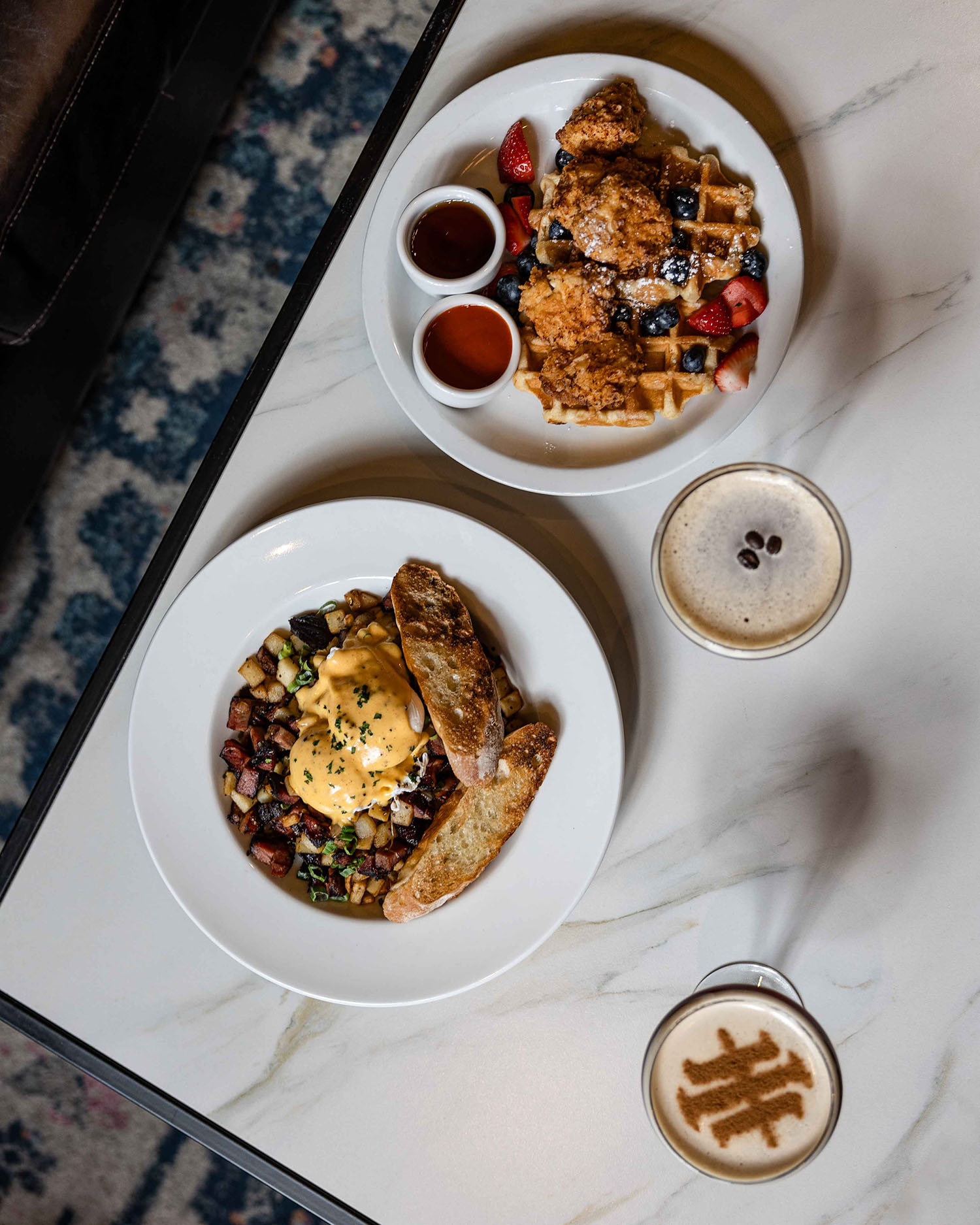 Overhead shot of multiple brunch dishes on a table at Hubbard Inn in River North Chicago IL