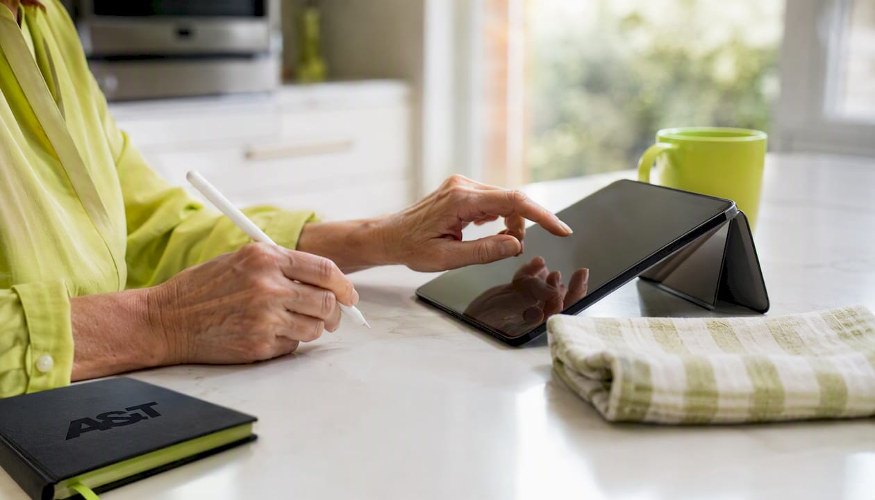 Hands scrolling healthcare patient portal tablet