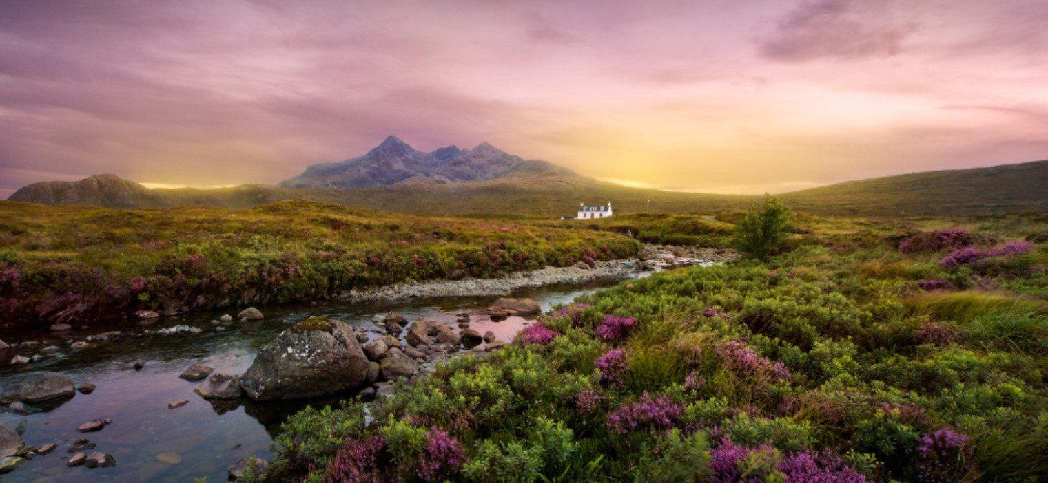 an aerial view of a desert with rocks and sand