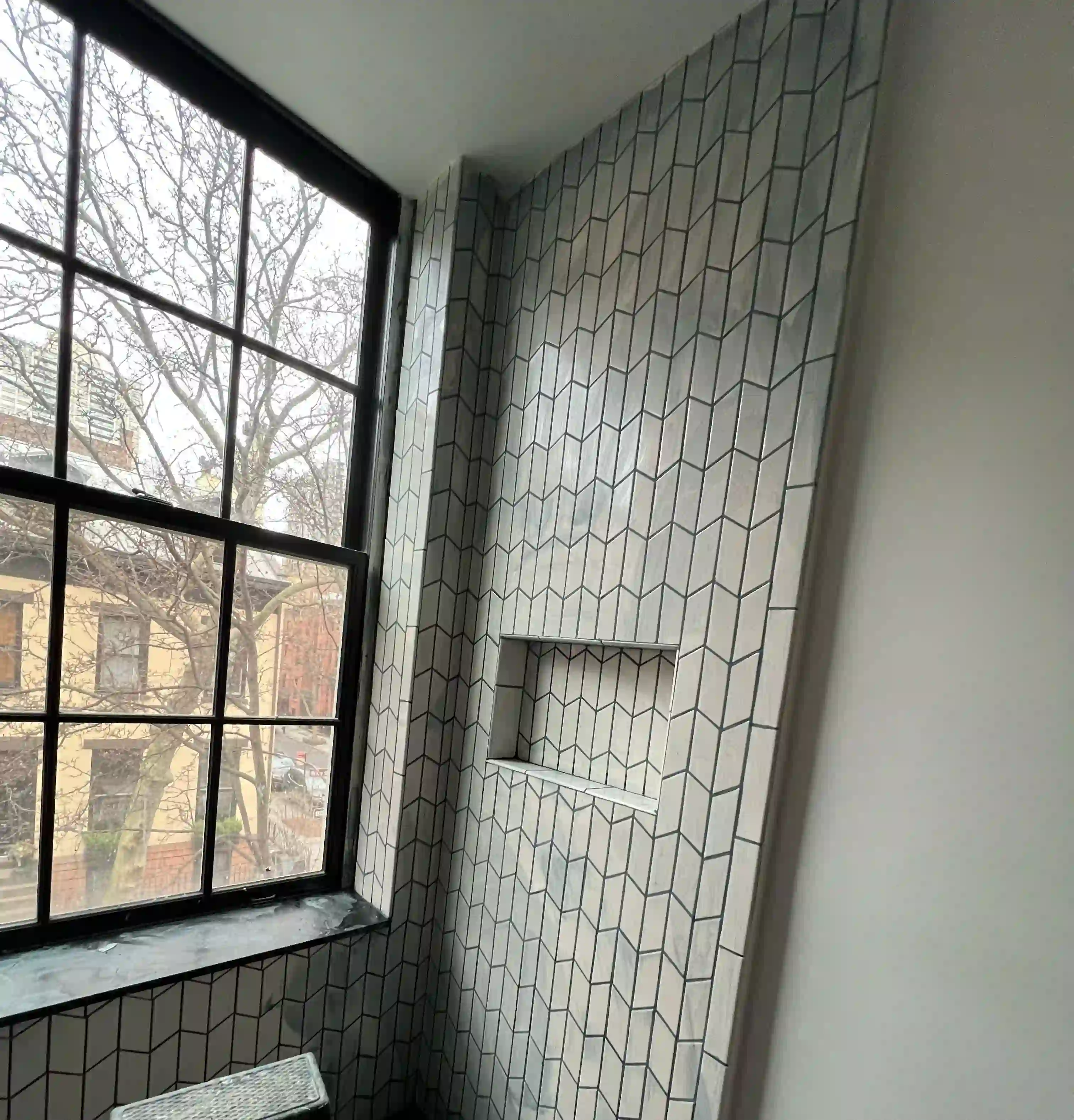 Trex composite deck stairs with picture framing, recessed lighting, and Transcend railings in Queens, NYC