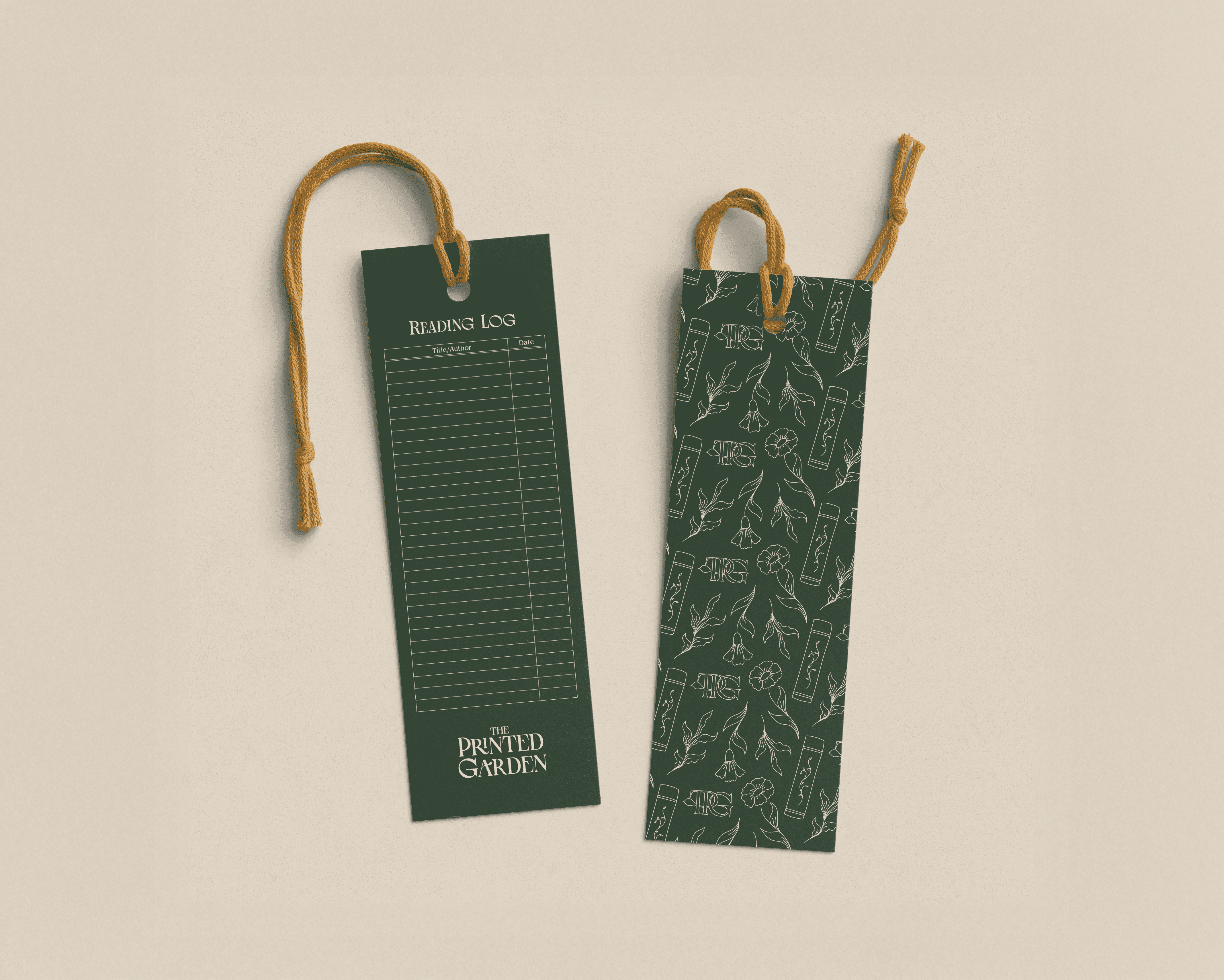 Dark green bookmarks: one a reading tracker, one with leaf patterns.