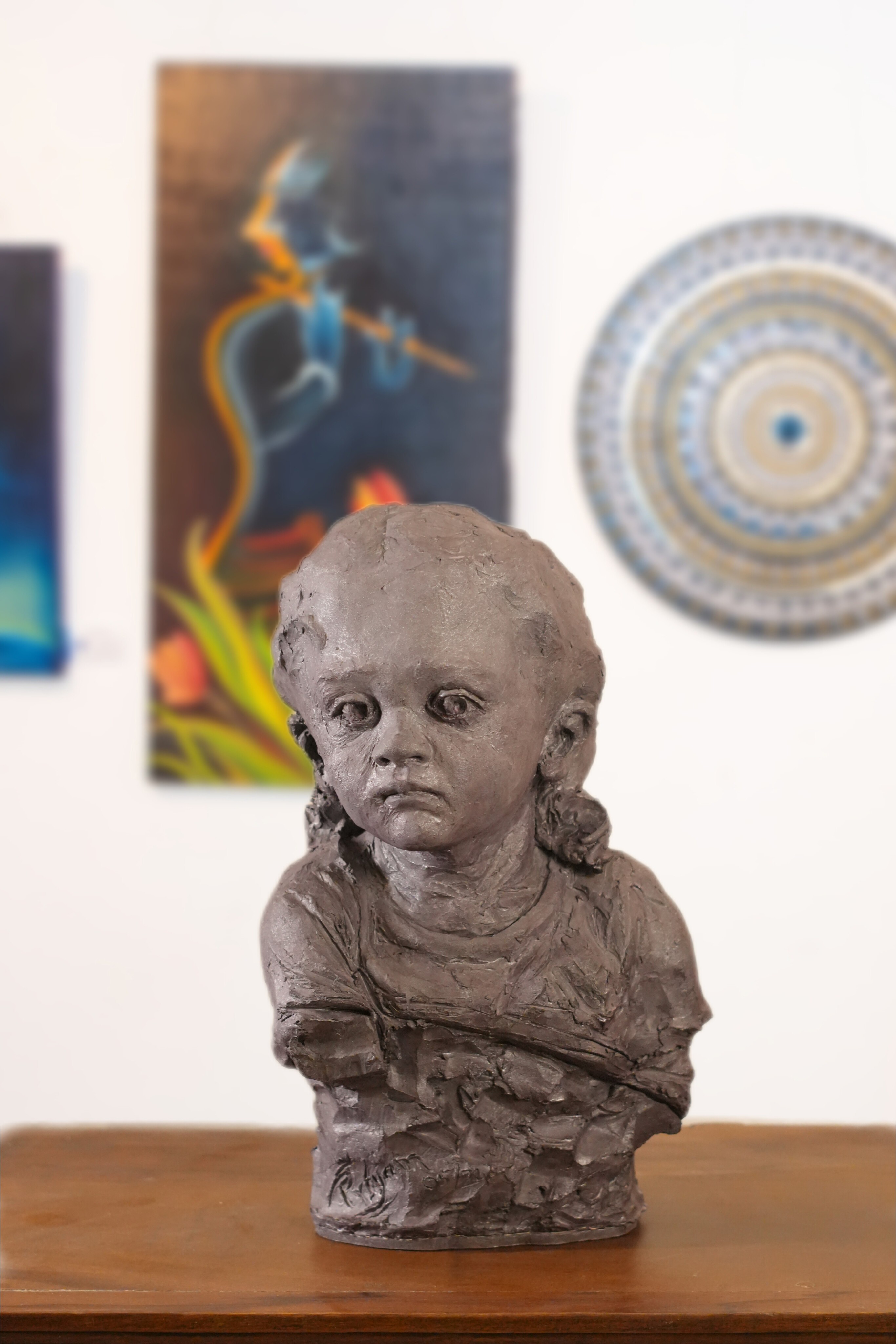 portrait sculpture of a young child