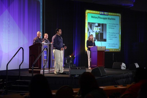 Kamran Farid speaking at an Edible Arrangements Event