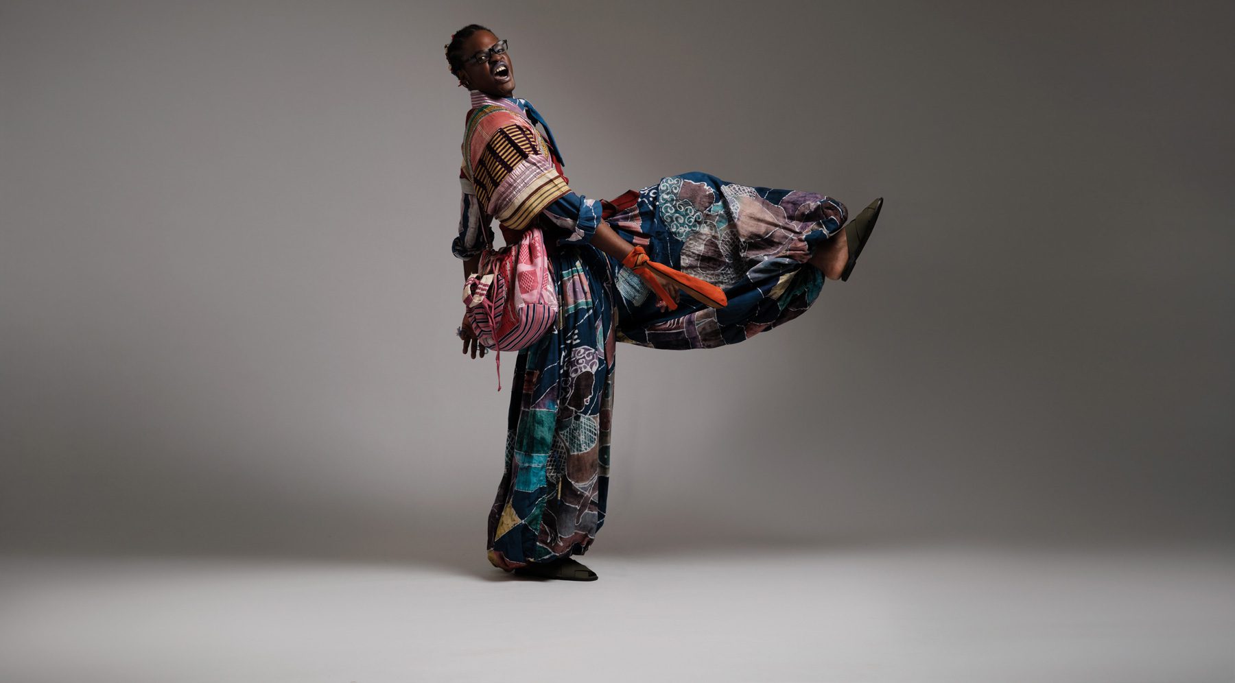 a person holding a cell phone in their hand