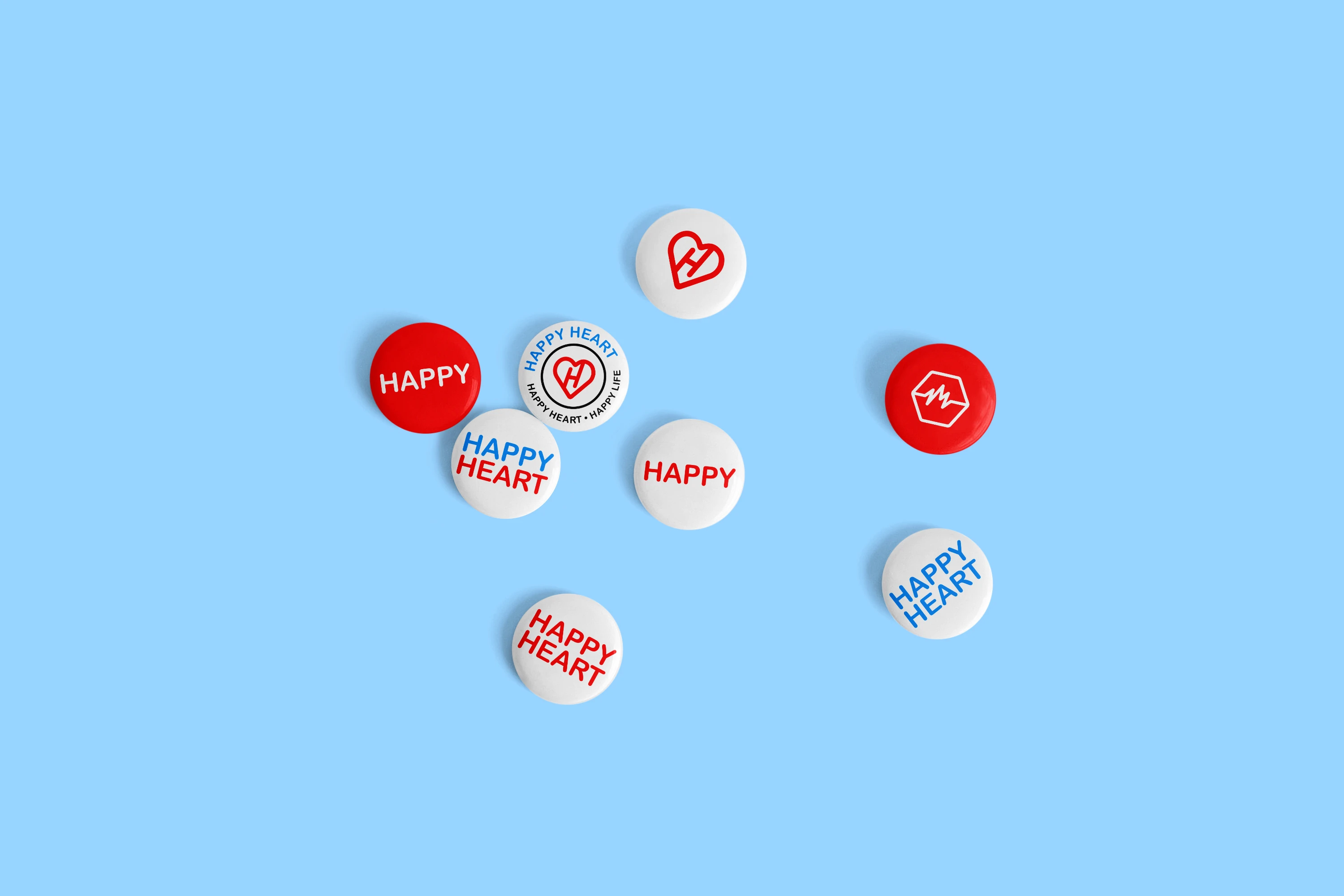 A soft blue backdrop with various red and white buttons displayed on it.