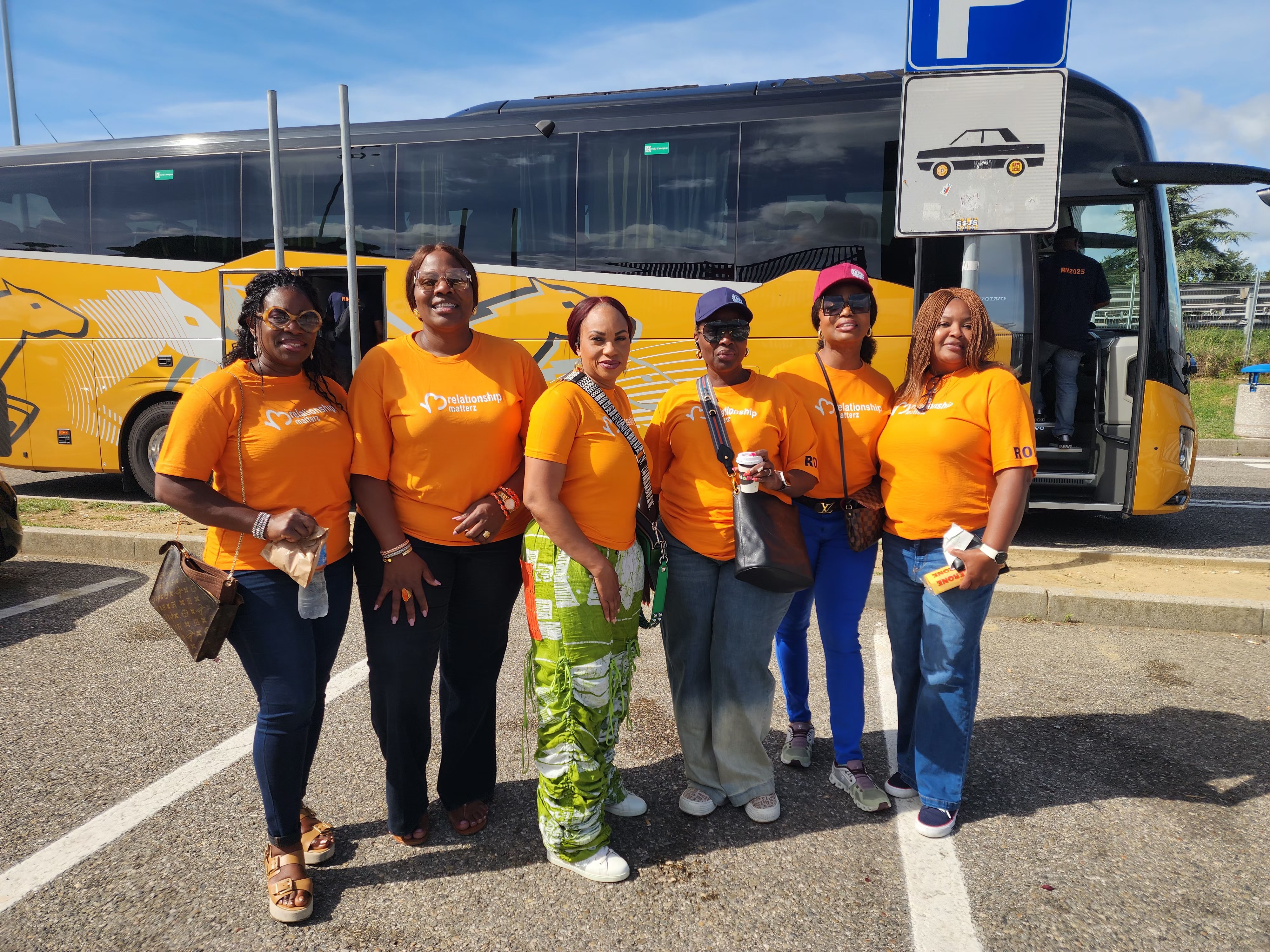 A man stading with Surfboard