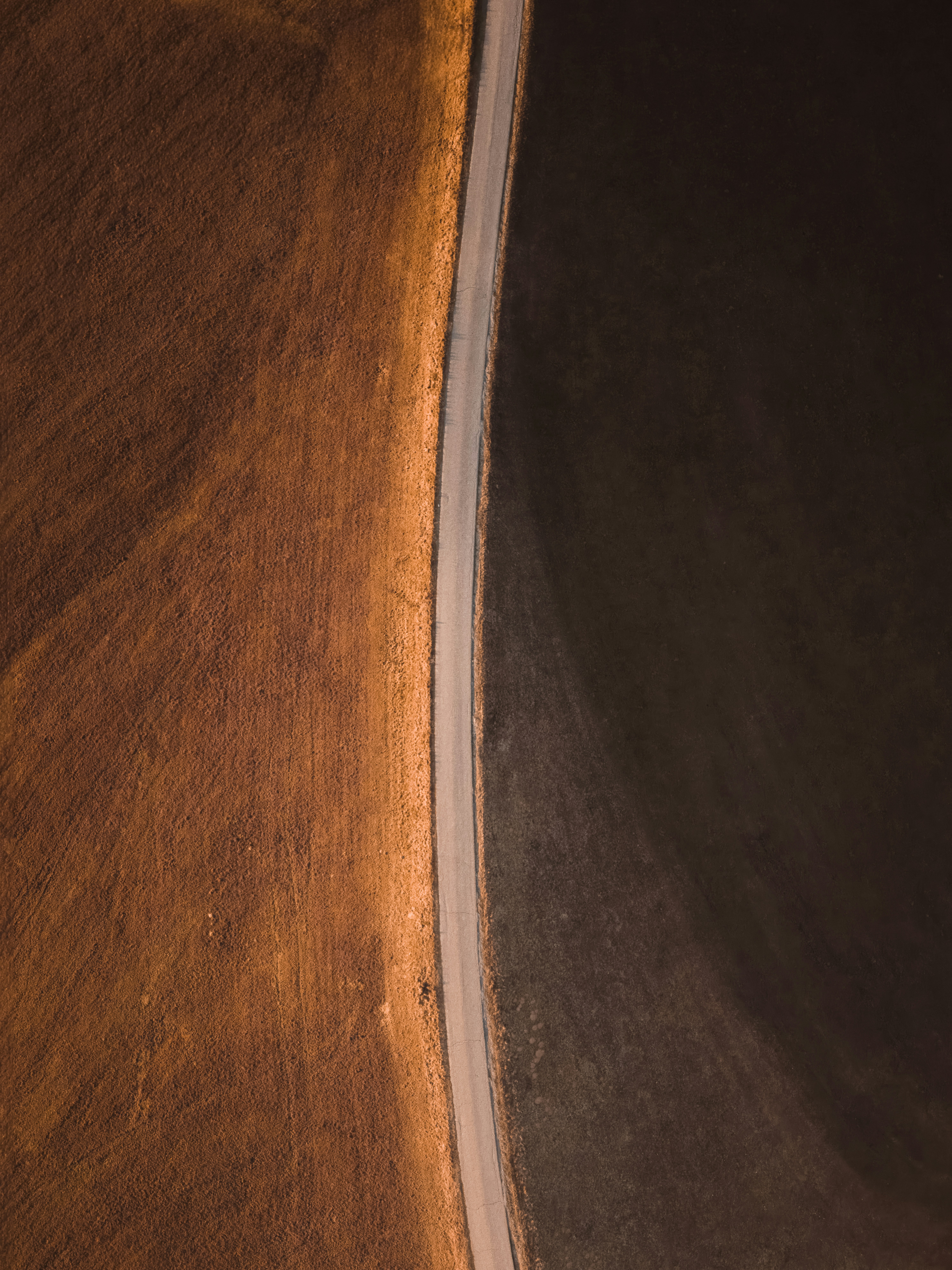 Modern curved staircase with warm ambient lighting