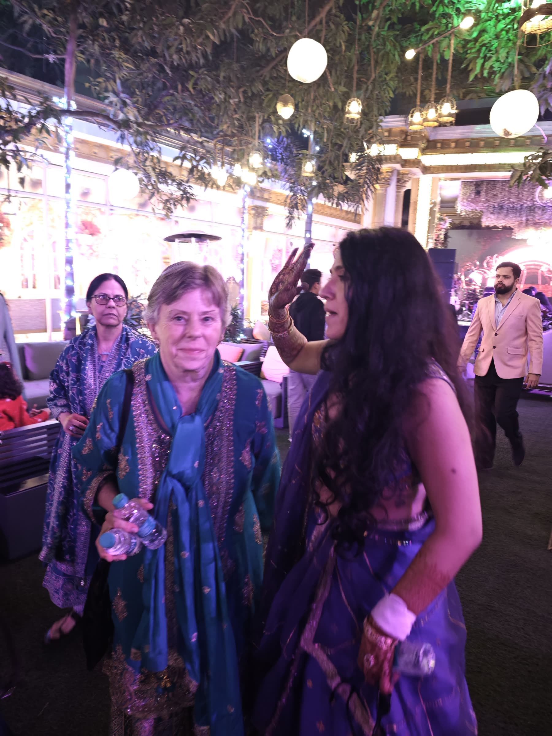 Family members talking at an evening celebration