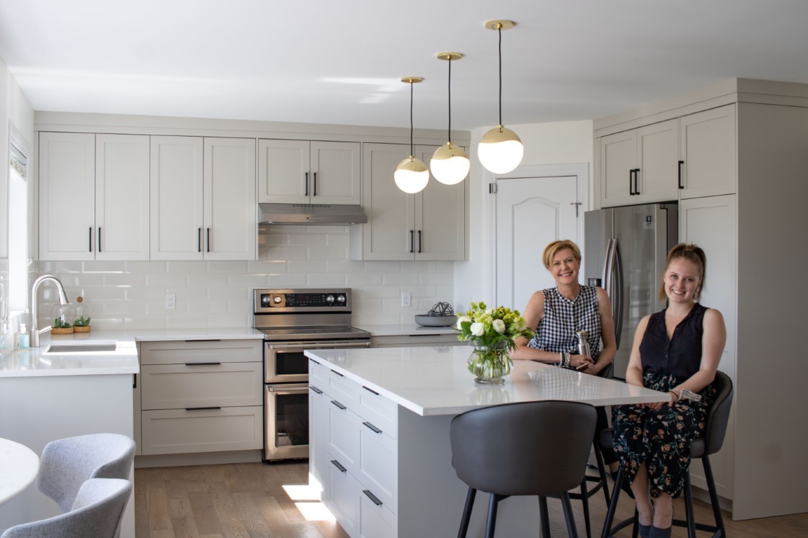 Image of KHD Homes kitchen design with island, stainless steel appliances, and modern furniture for home renovations.