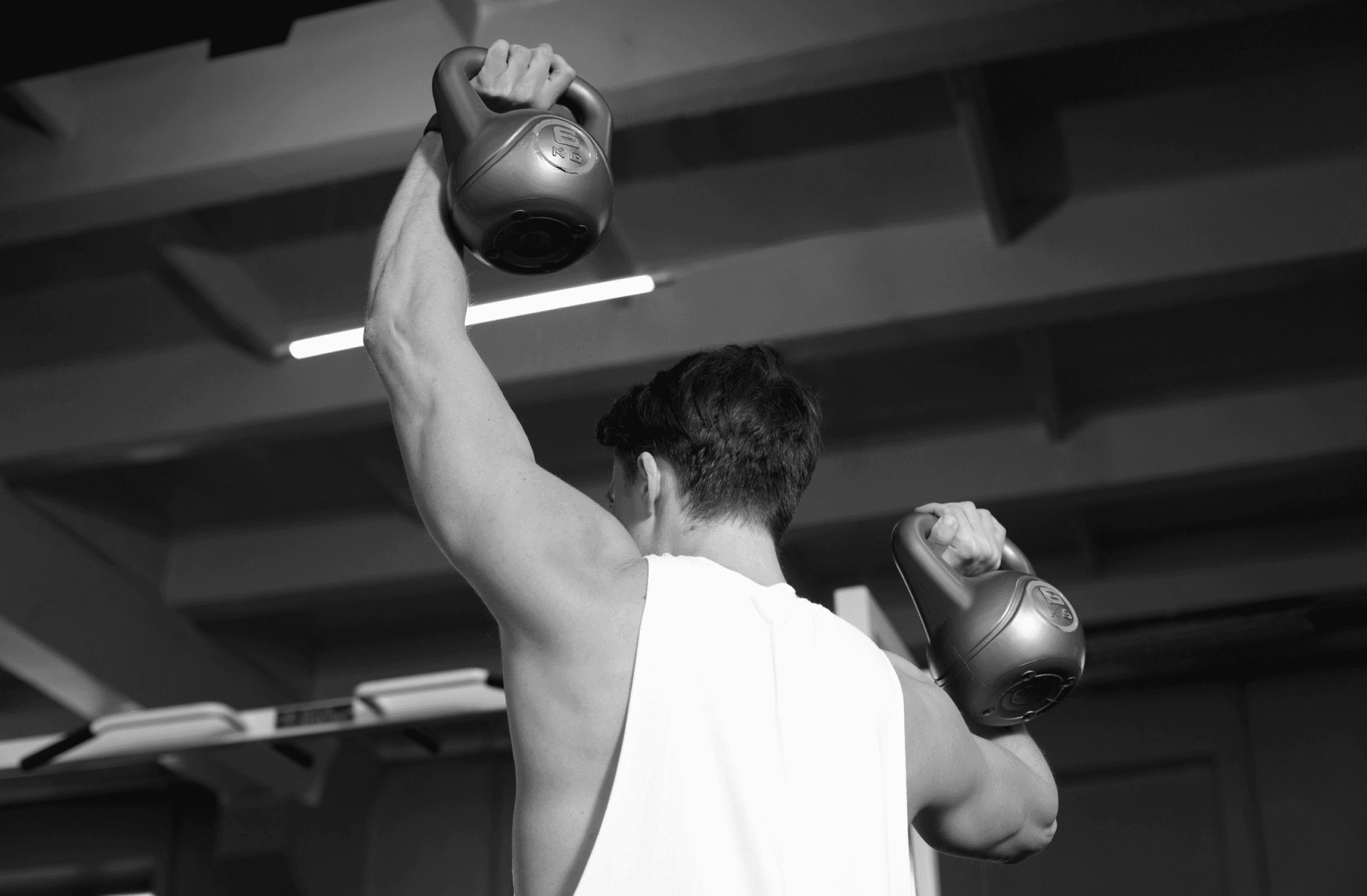 Focused man performing full-body strength workout