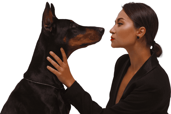 Woman holding her dog by the neck