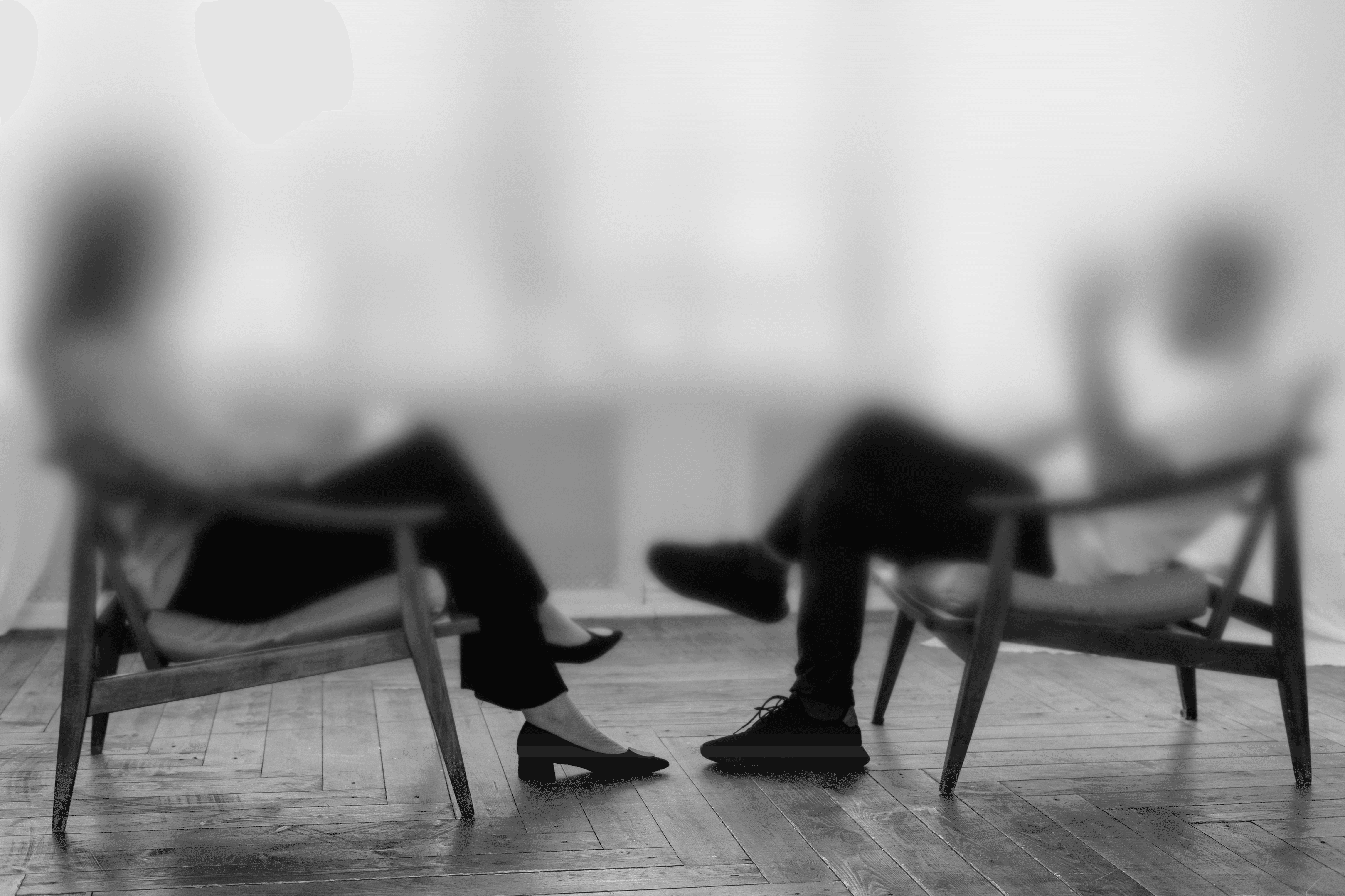 Abstract black ink splatter on white background.