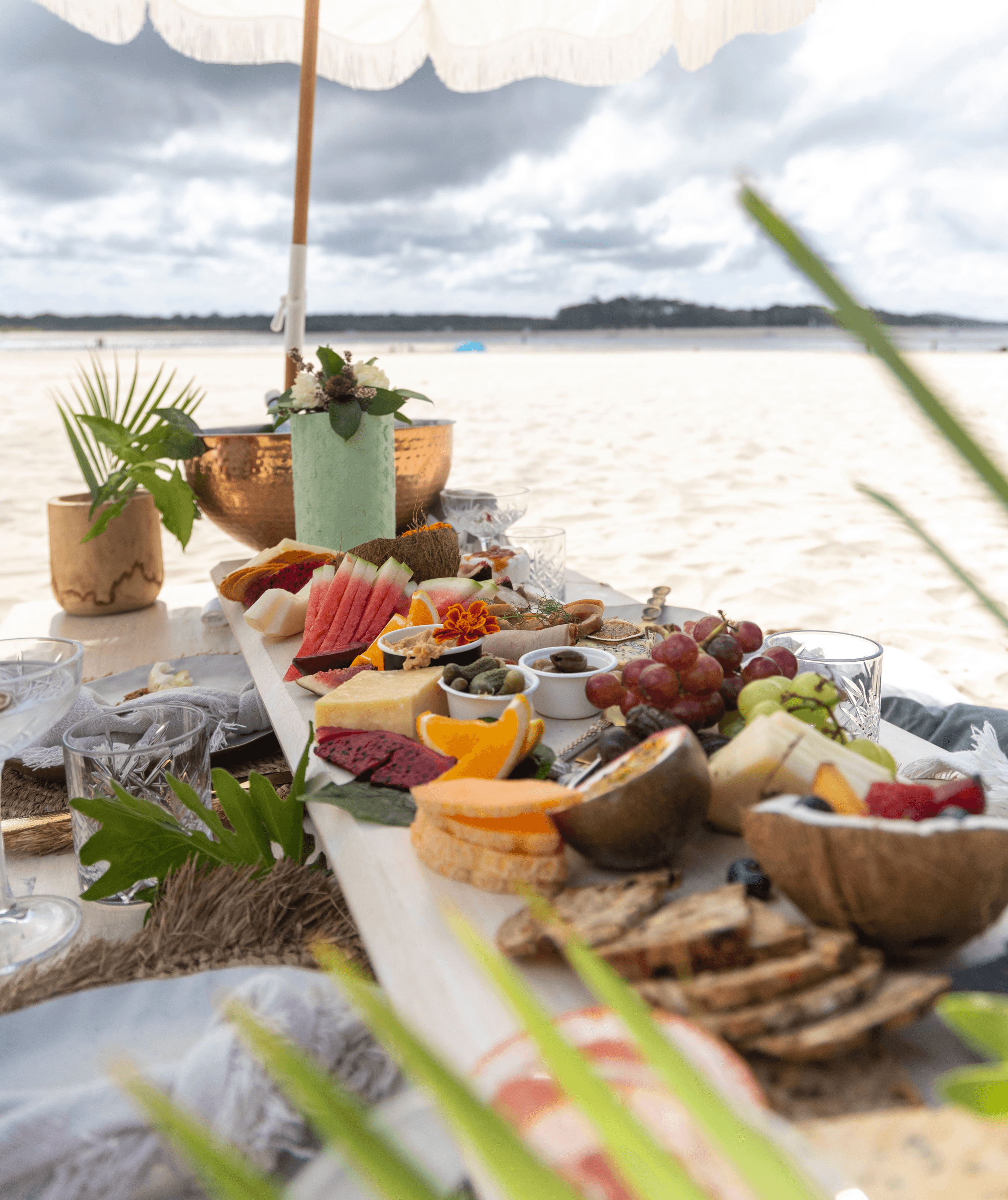 An appetizing spread of fruits and drinks being enjoyed while at sea.