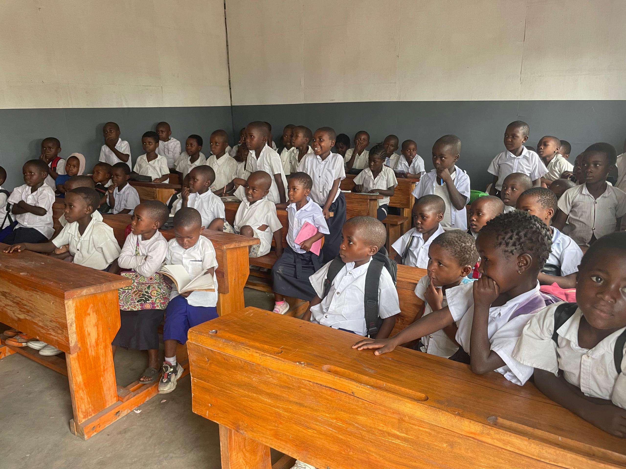 group of people standing near brown concrete building during daytime