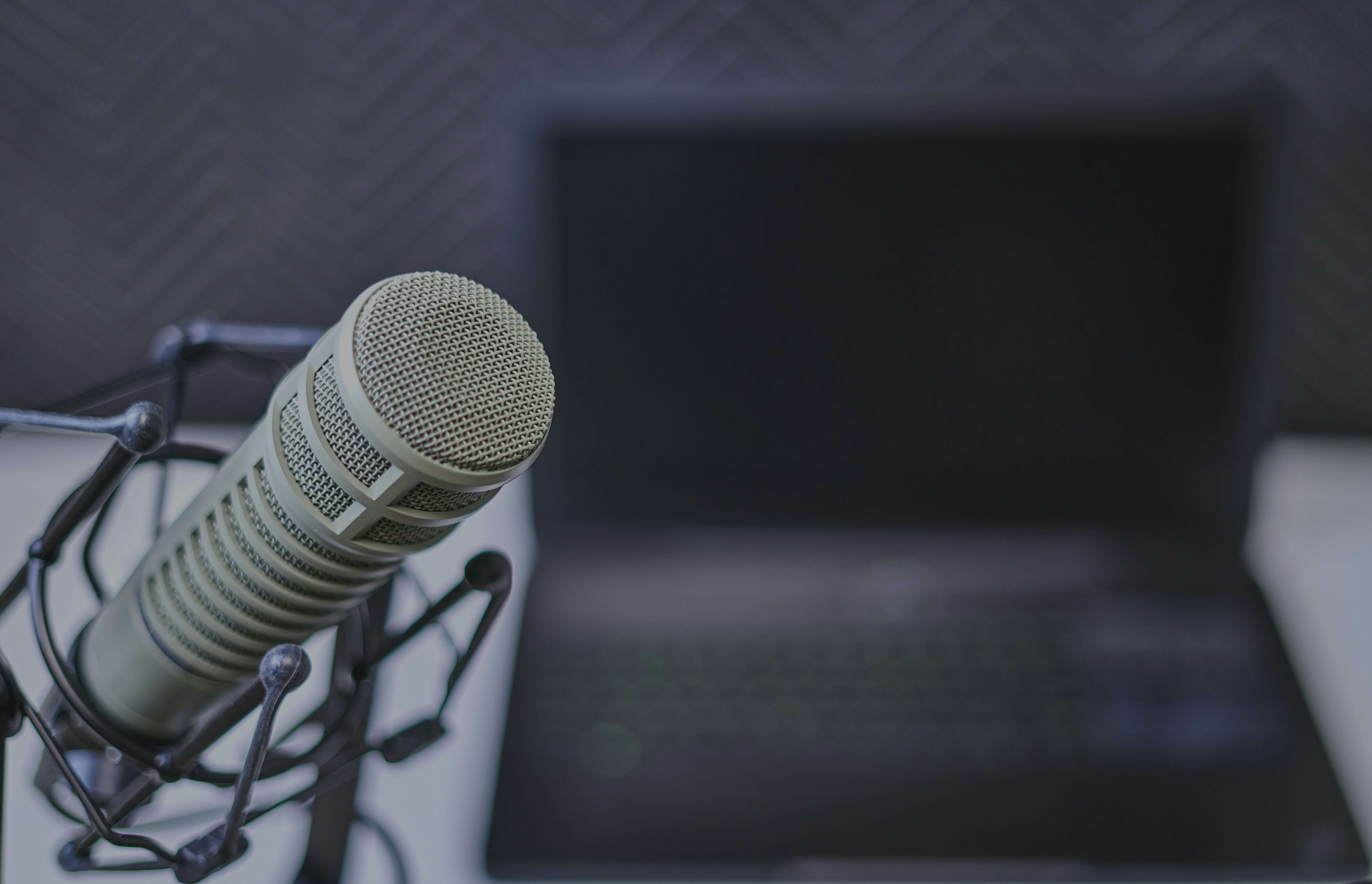 person with mic and laptop getting ready for AI Voice Singing 