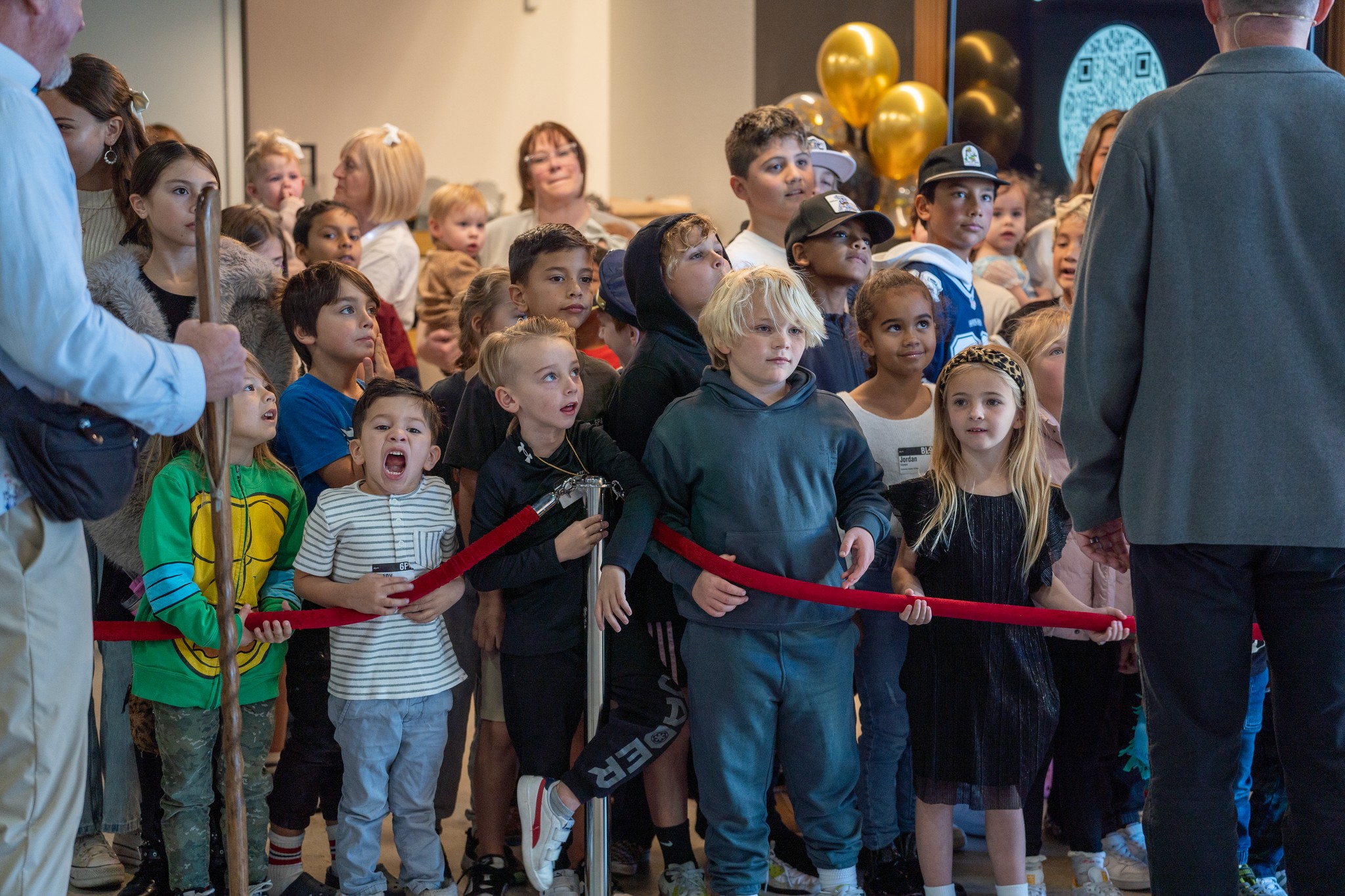 two people looking at a tablet and smiling