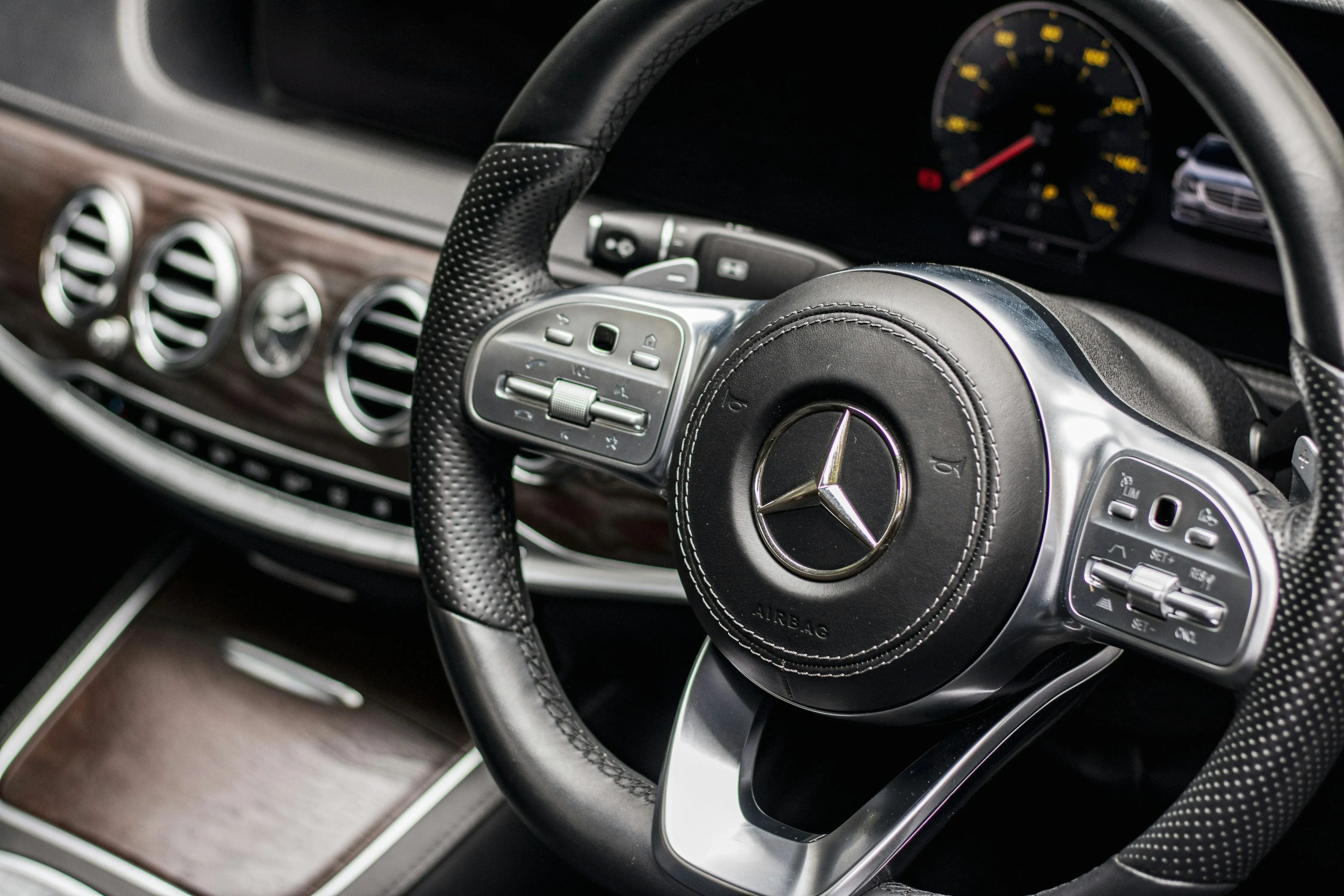 the steering wheel and dashboard of a car