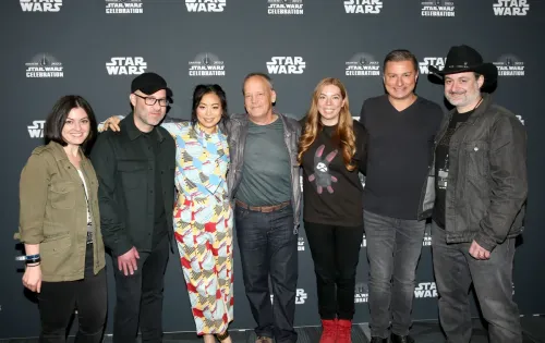 The cast and crew of the Bad Batch smiling at Star Wars Celebration