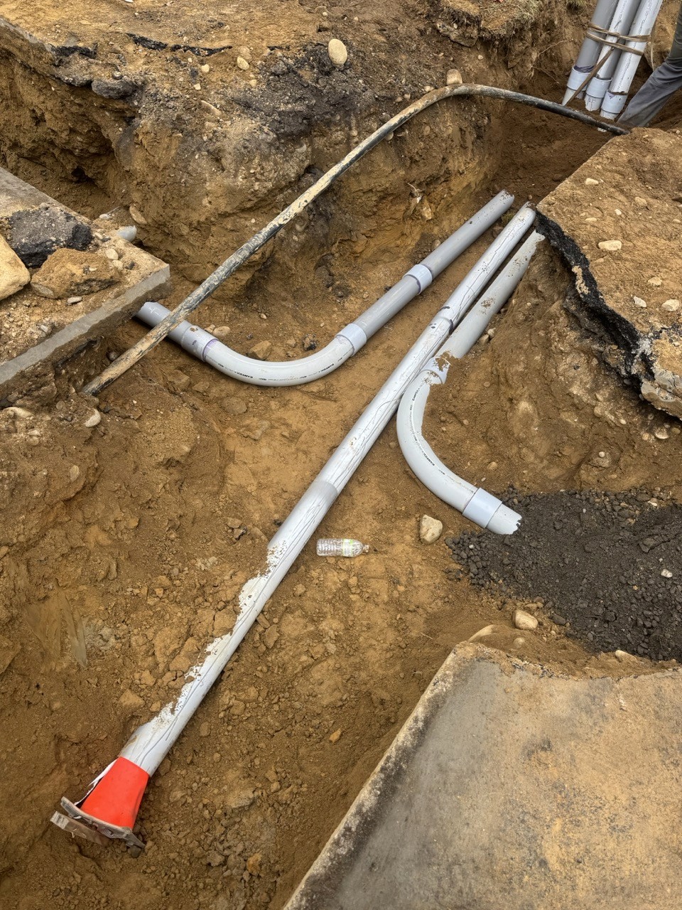 New water service pipes bedded in a sand trench