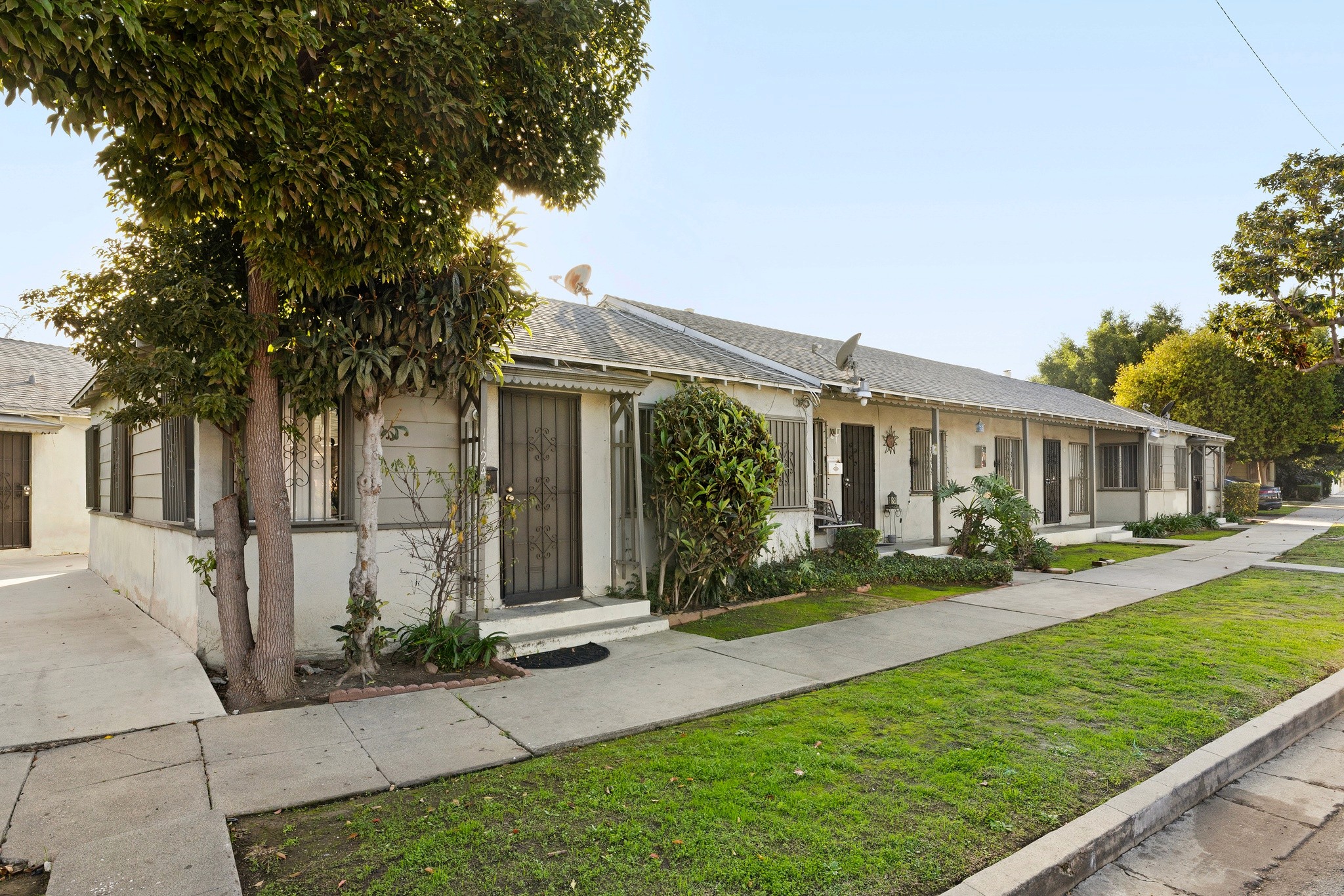 Front walkway and landscaped lawn frontage at 1105 E Hyde Park in Inglewood.