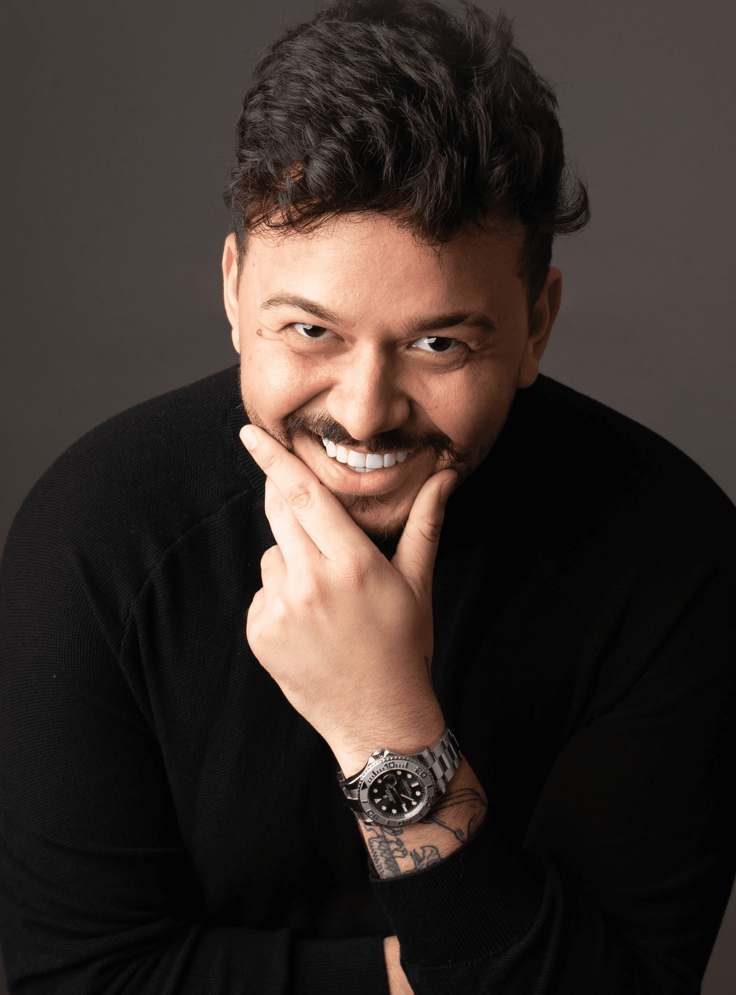 gold and black bottle on white wooden table