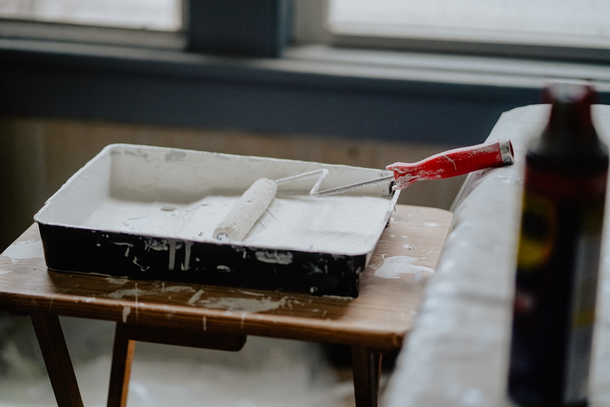 Paint roller and tray prepared for a Fayetteville house-painting estimate