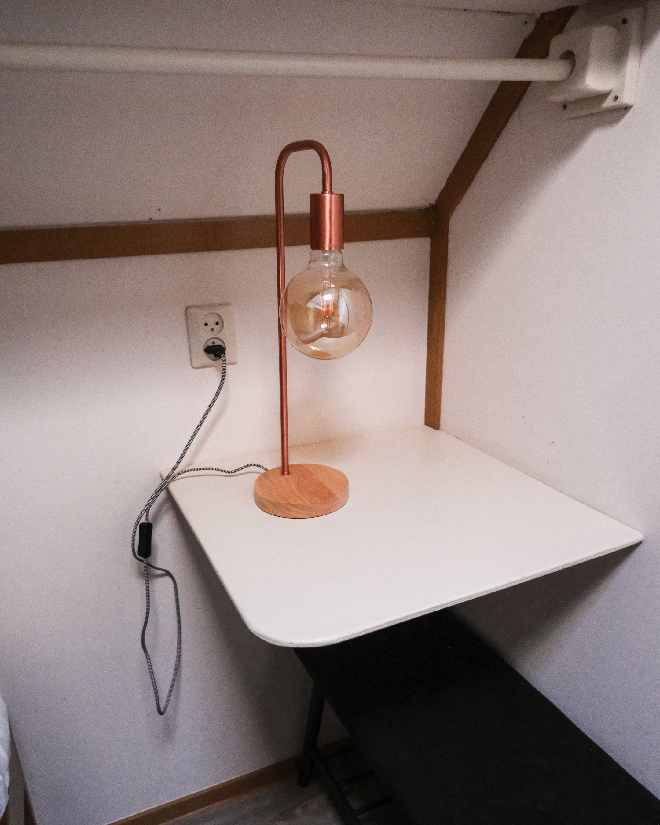 Gray sectional sofa with black coffee table and blue rug