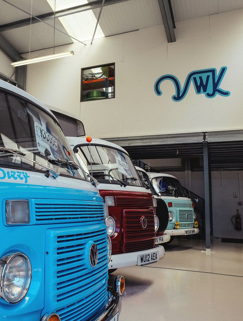 Camper van warehouse with VWK signage in the background