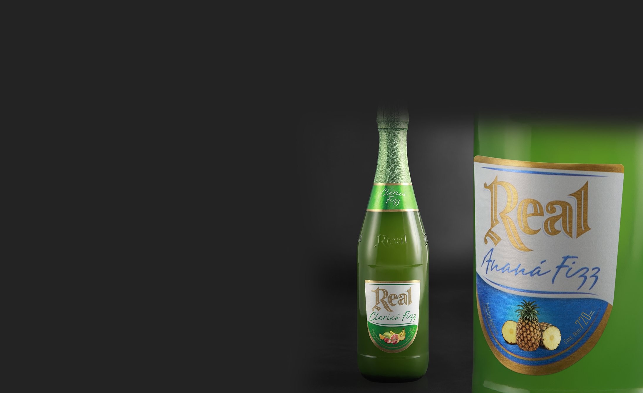 Two bottles of Real Ananá Fizz drink against a dark background. The bottles are green with labels featuring pineapples and elegant gold lettering.