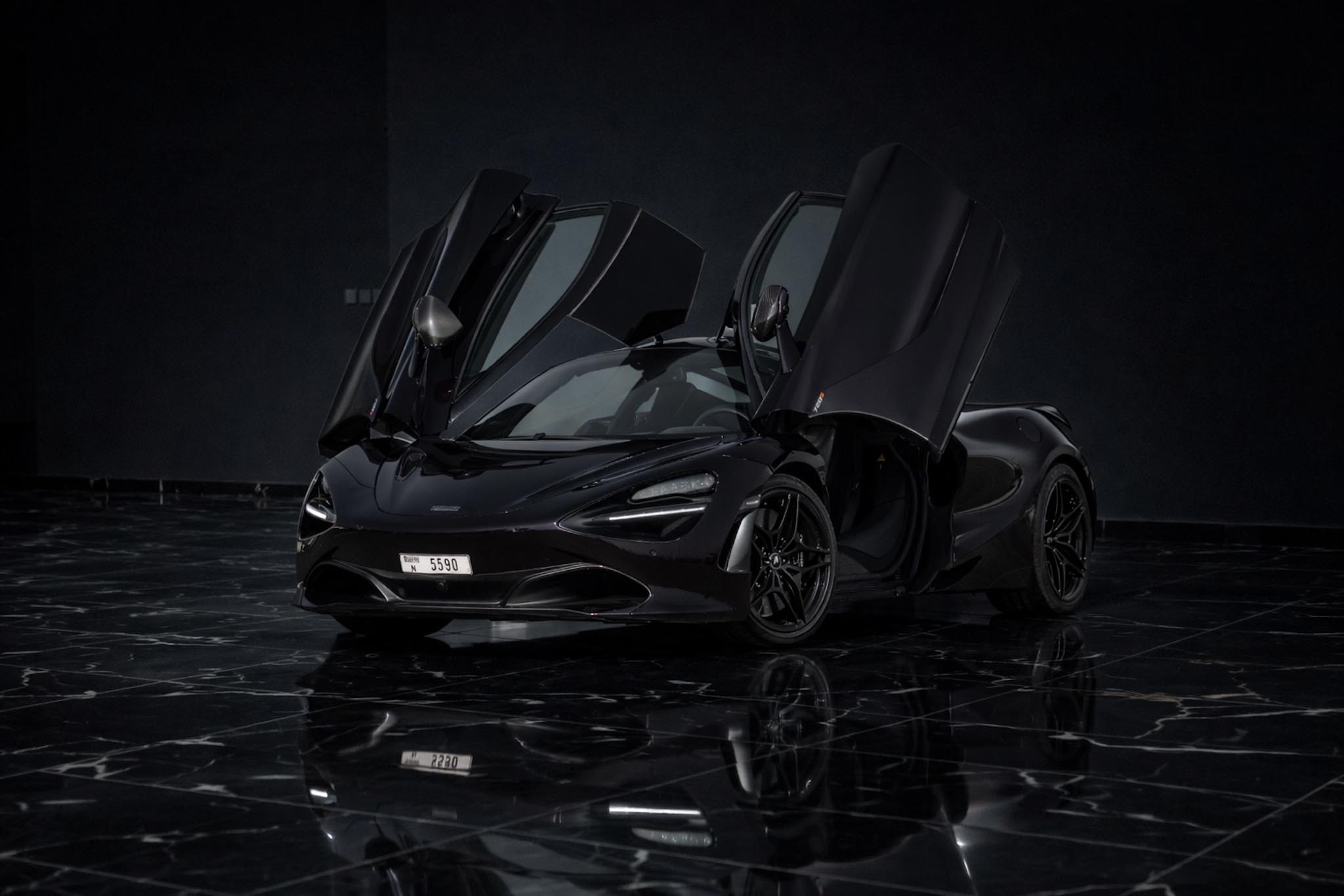McLaren 720S Coupe 2021 black front side exterior luxury supercar rental in Dubai