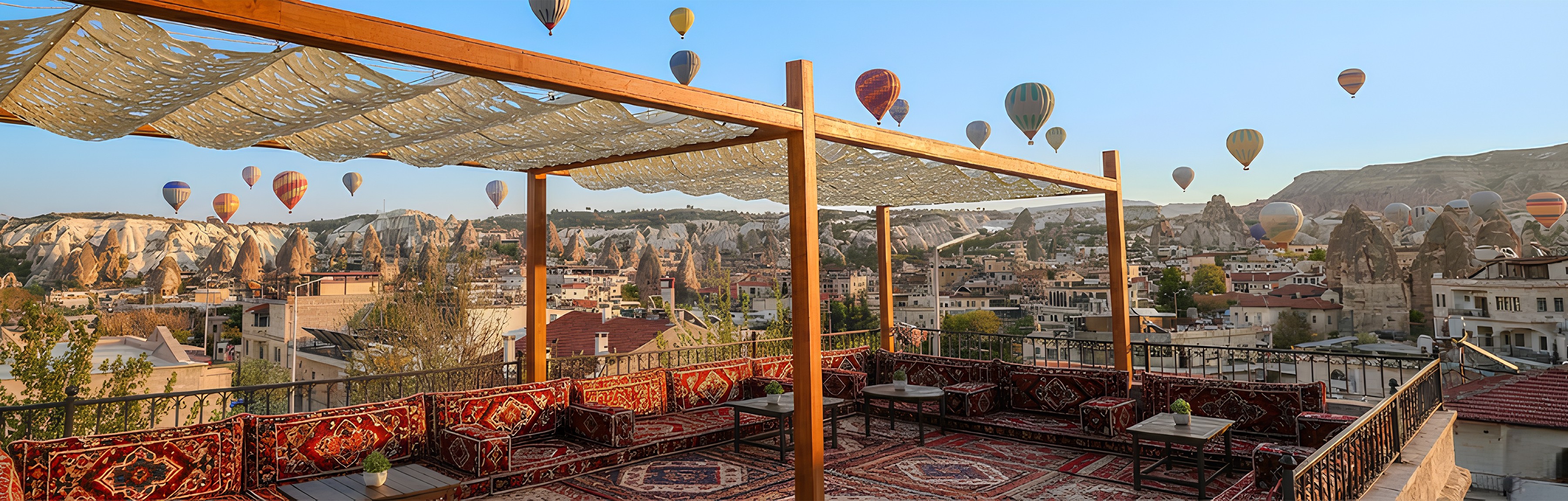 woman holding a phone and man looking at the phone. both are smiling