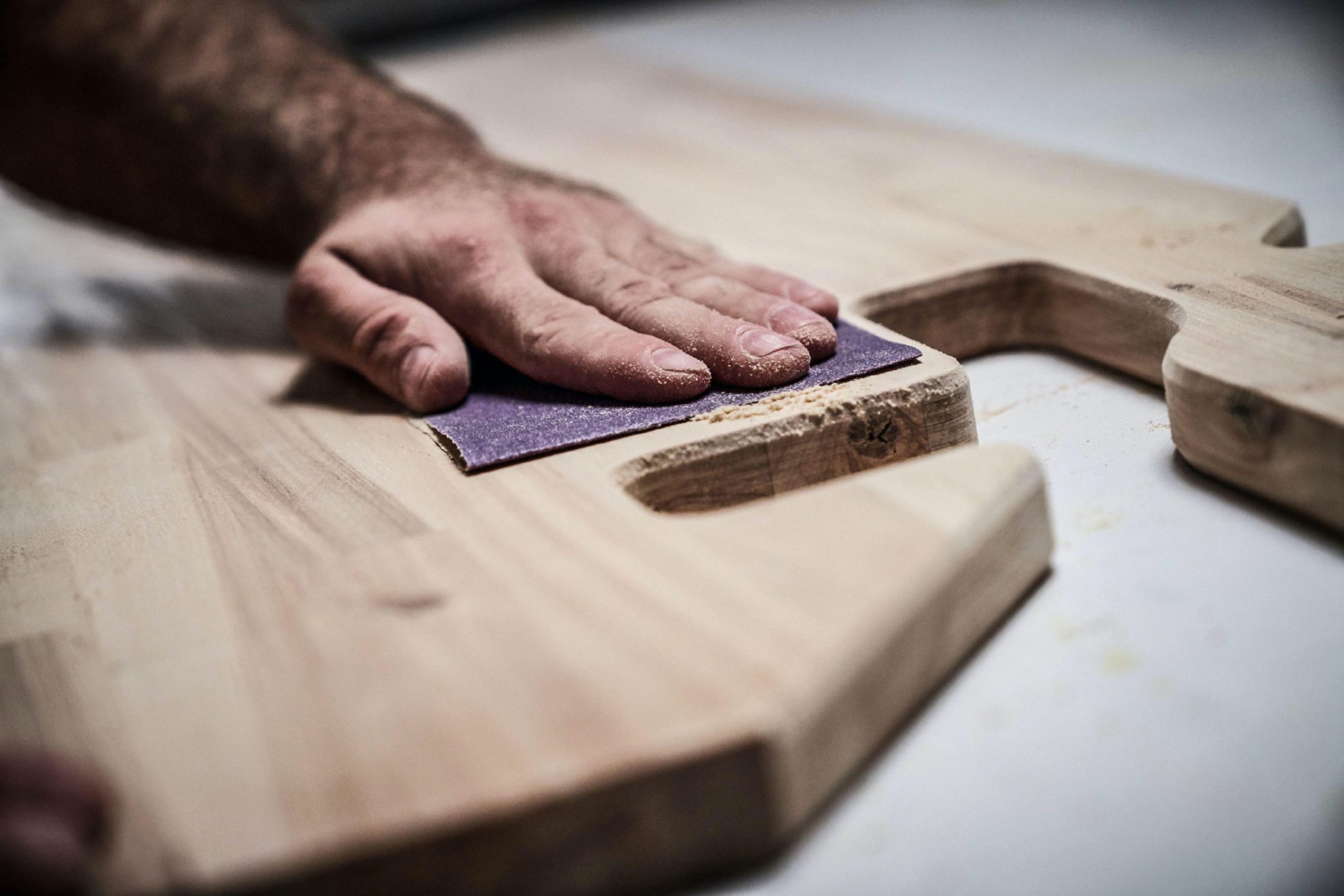 Person sanding wood