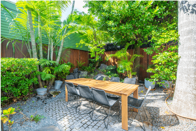private garden area surrounded by lush greenery—an exclusive Key West sanctuary for relaxation