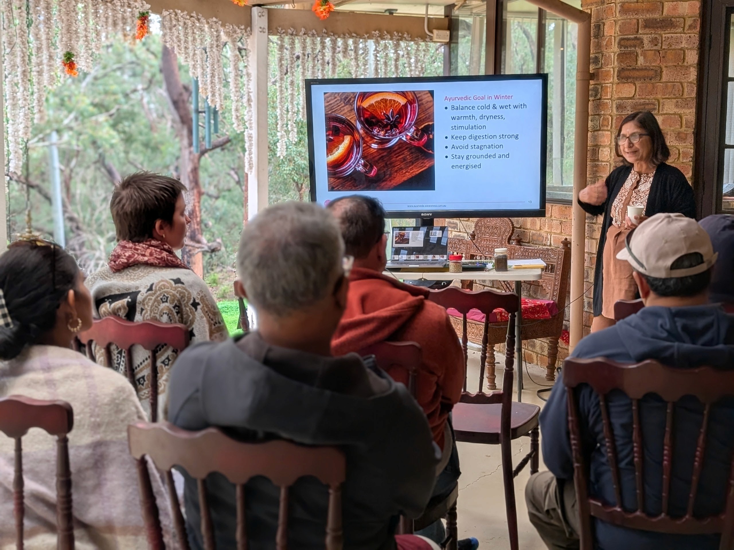A couple in formal wedding attire embraces intimately in a vast.