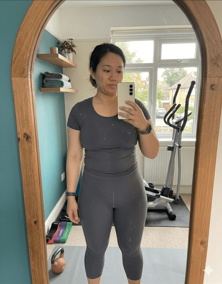 Amelia before fitness transformation – front view mirror selfie in grey t-shirt and black shorts