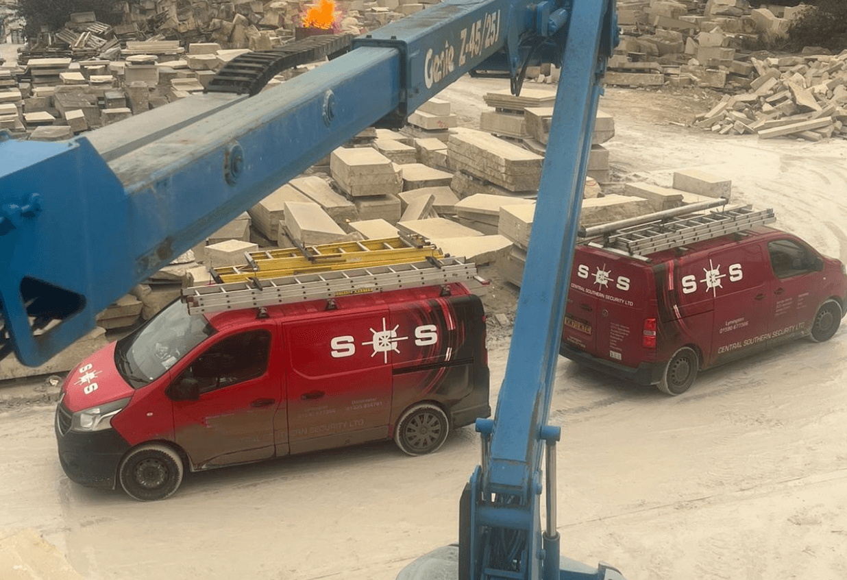 a man working on a wall with a screwdriver