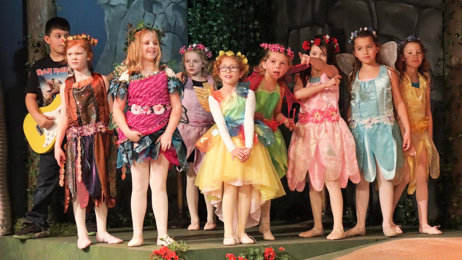 kids on stage in a youth theater production