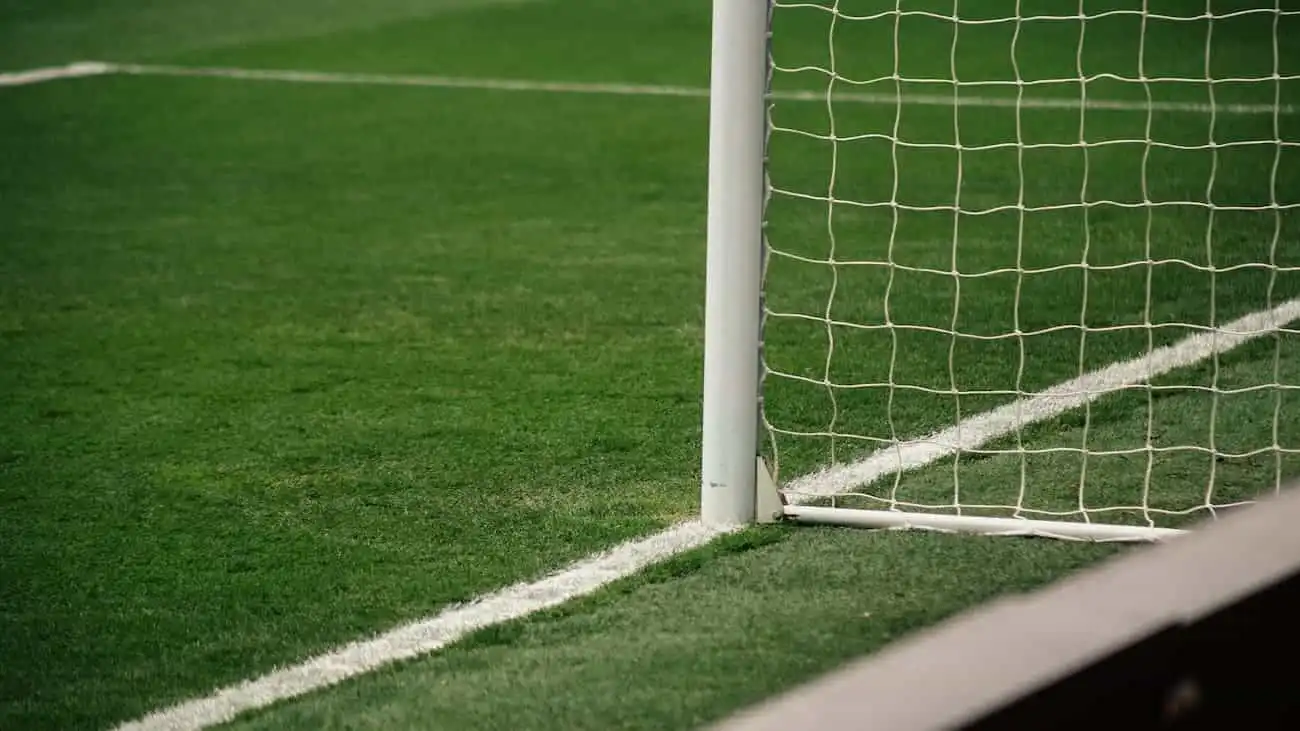 Close-up of a football goal that underlines the central importance of talent promotion and player development in youth performance centres.