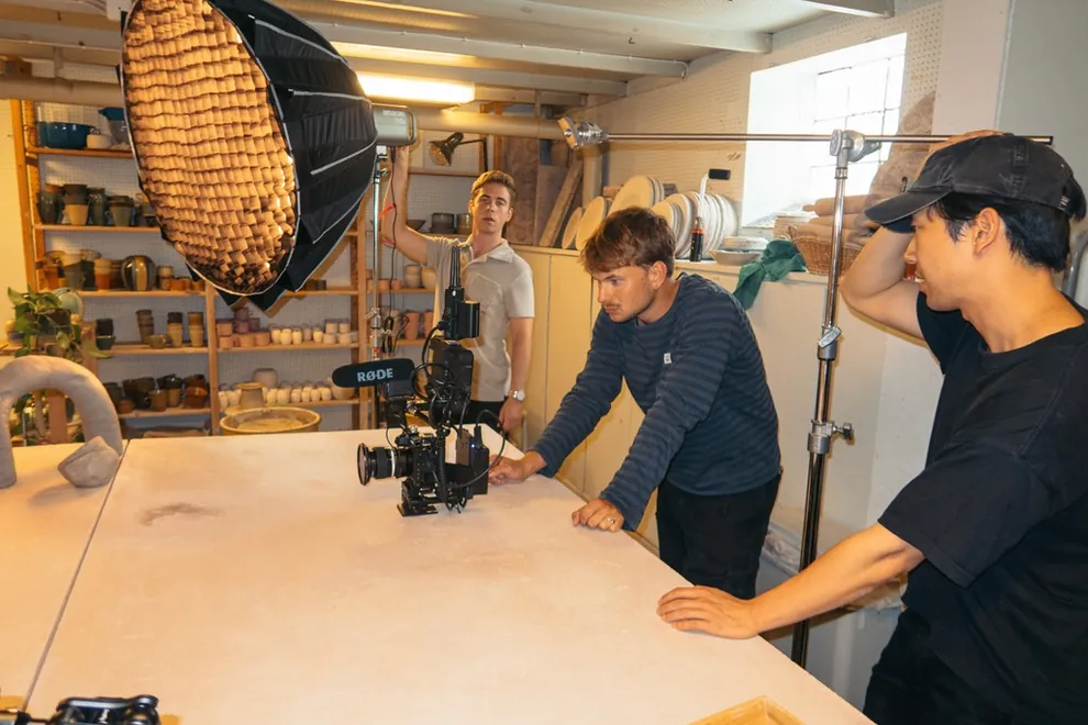 Film crew with a cinema camera and a softbox light on set, Alecta film
