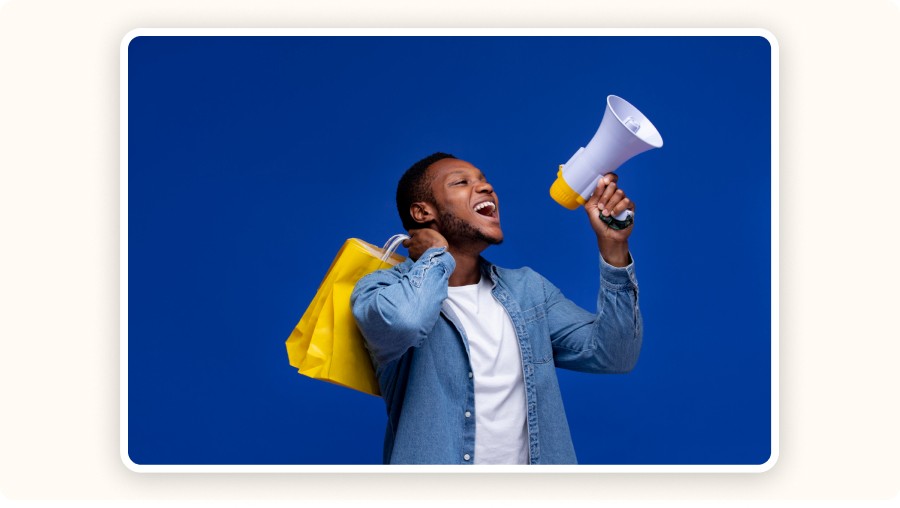 man holding bag and megaphone