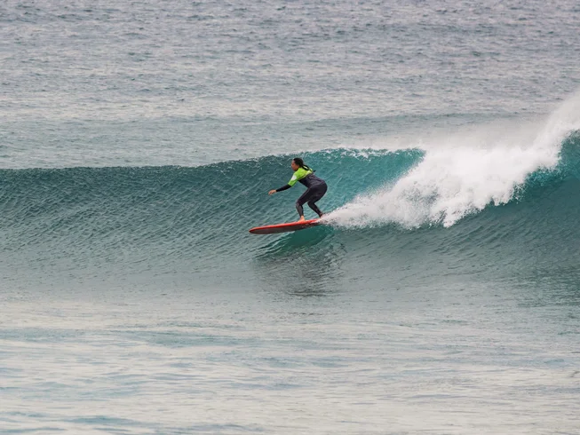 Laid-back surf and yoga retreat on the wild west coast with daily sessions and a social camp feel.