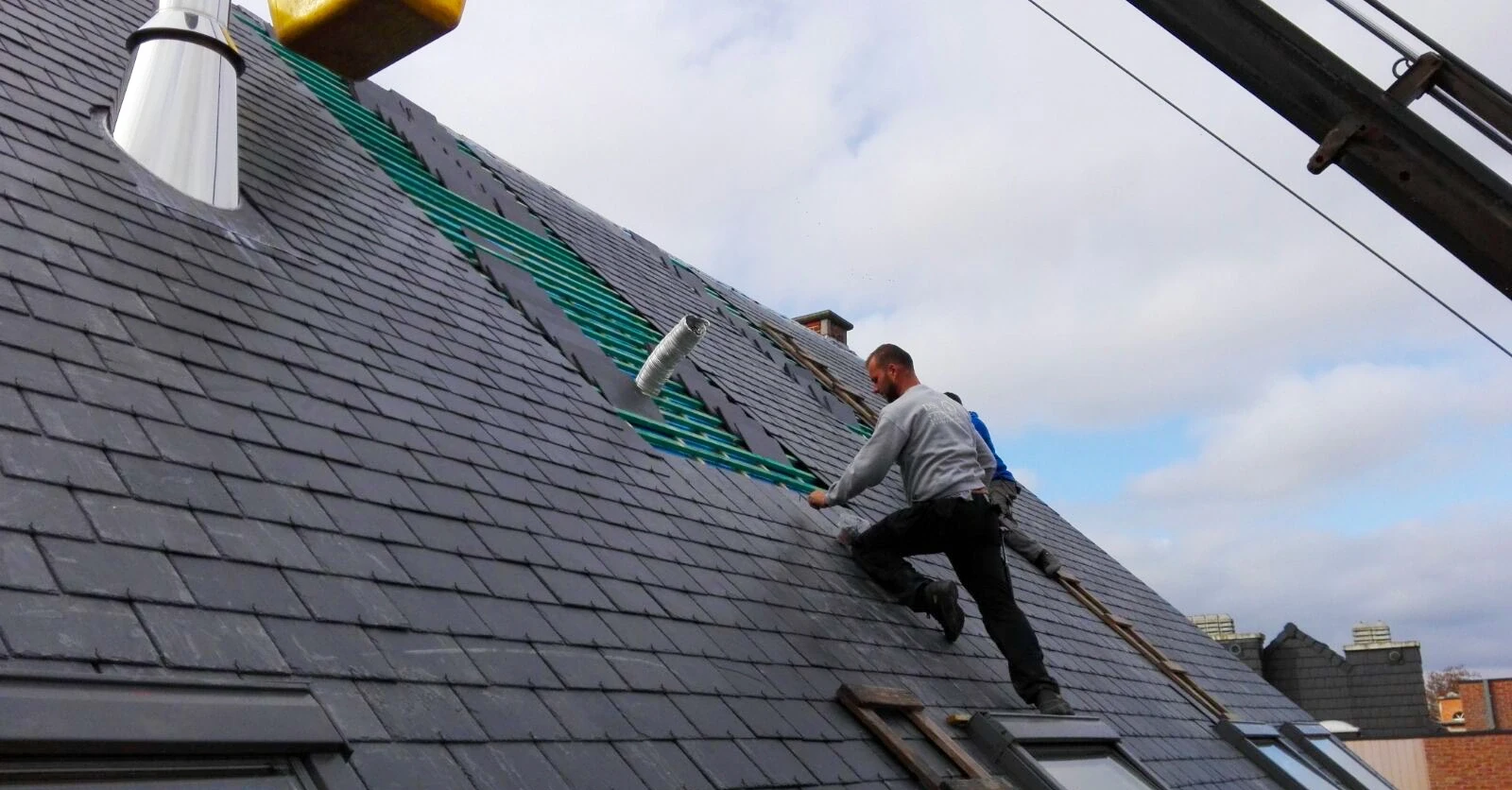 A man working on a roof.