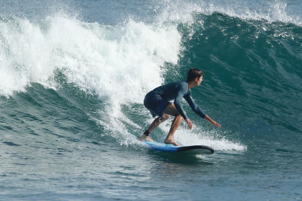 A man doing surf stunt