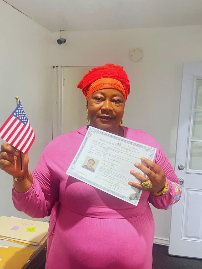 Satisfied client smiling after successful immigration case with Fibi Law Firm