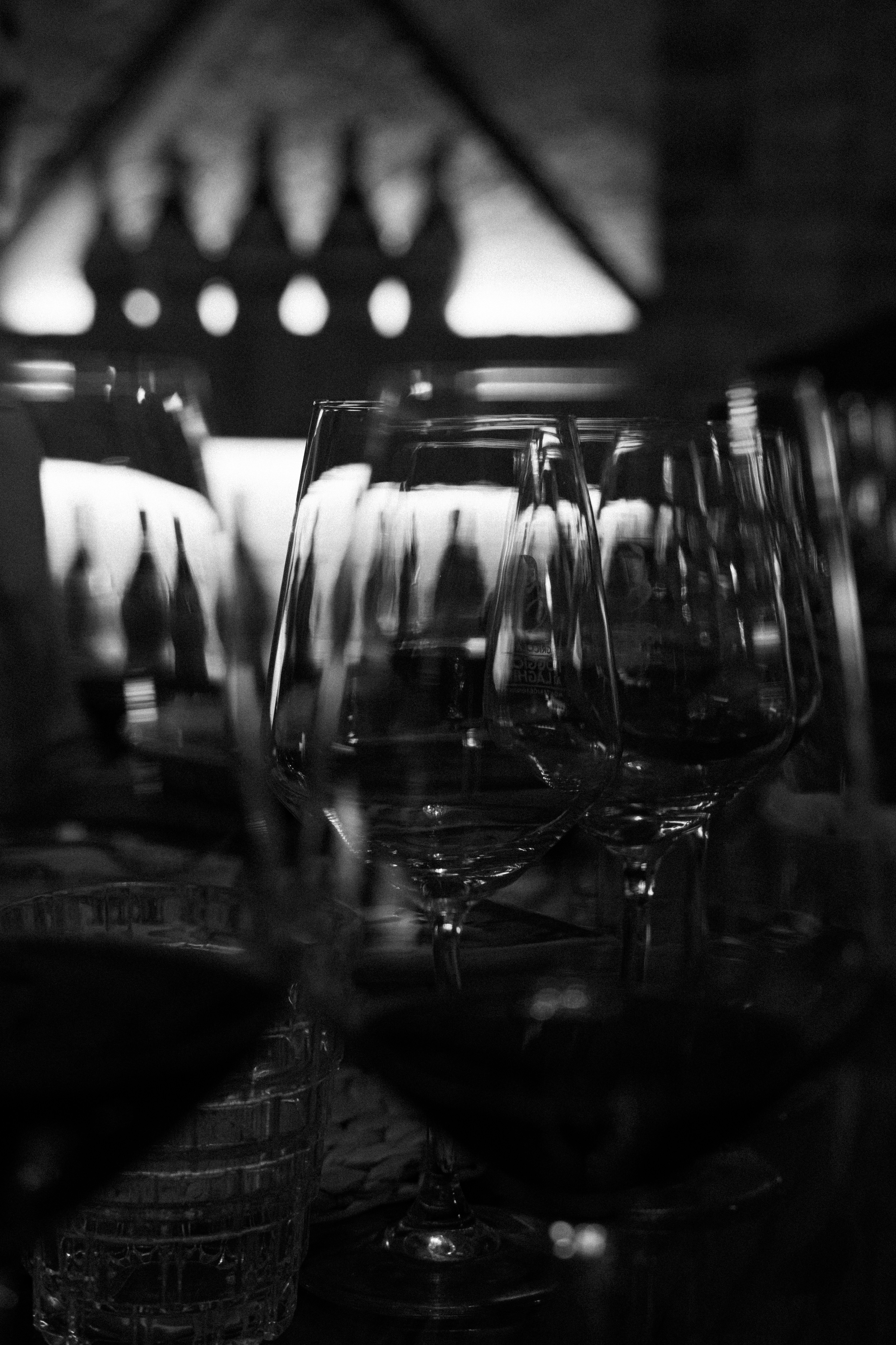 Empty wine glasses in a dimly lit room.