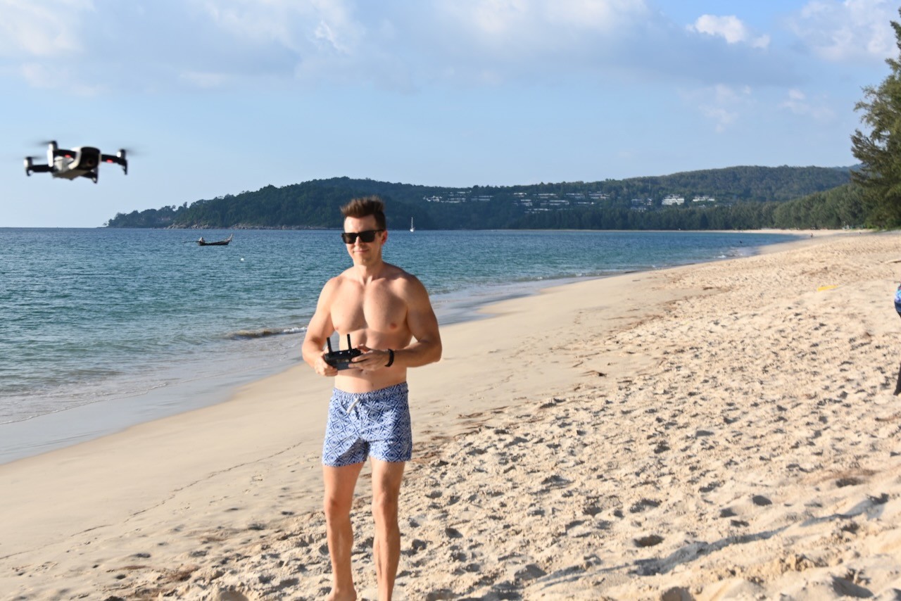 my man flying the drone in phuket