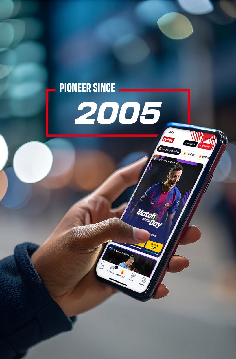 Betclic Group - Hand holding a smartphone showing the Betclic