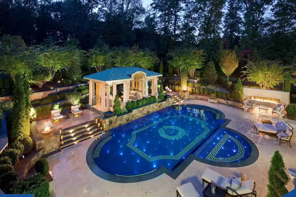 Mosaic pool with Greek and Roman-inspired mosaic borders, featuring intricate patterns and vibrant b.